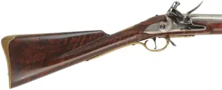 1756 British Artillery Carbine,
.62 caliber smoothbore, 37" barrel, 
flint lock, figured Claro walnut, bras trim, used